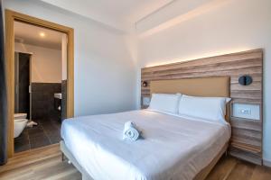 Postel nebo postele na pokoji v ubytování B&B HOTEL Sassari