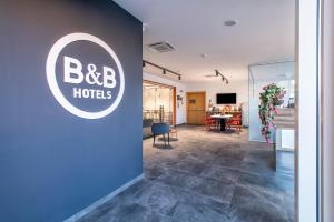 TV a/nebo společenská místnost v ubytování B&B HOTEL Sassari