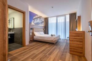 Postel nebo postele na pokoji v ubytování B&B HOTEL Sassari