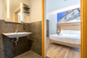 Postel nebo postele na pokoji v ubytování B&B HOTEL Sassari
