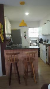 Η κουζίνα ή μικρή κουζίνα στο Casa aconchegante
