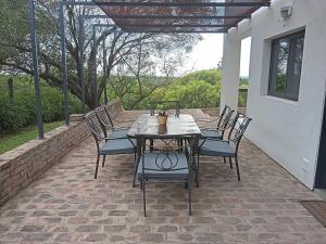 a table and chairs sitting on a patio at Tranquila Casa de Campo in La Granja