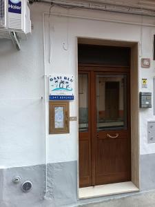 a door to a building with a sign on it at Oasi Blu in Montalbano Jonico