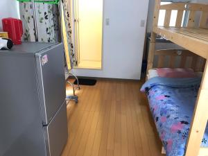 Palanda nebo palandy na pokoji v ubytování 新宿東京暖房