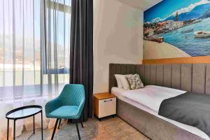 Postel nebo postele na pokoji v ubytování Hotel Boka