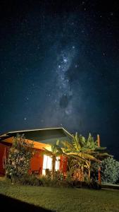 a house at night with the milky way at Manu Kehu in Hanga Roa