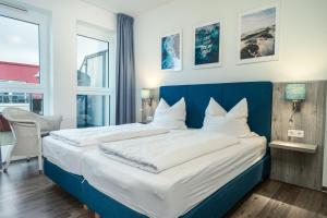 Postel nebo postele na pokoji v ubytování Residenz Bollwark 223