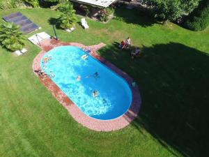 an overhead view of a swimming pool in a yard at Landhof Kützin Ferienhaus 6 Specht in Wulfskuhl