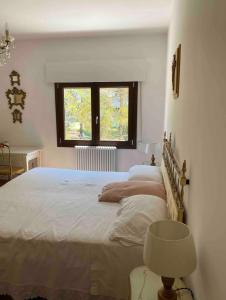 a bedroom with a large bed and a window at Venice barocco bedroom in Lido