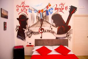 Letto o letti in una camera di Solemare Musica & Poesia