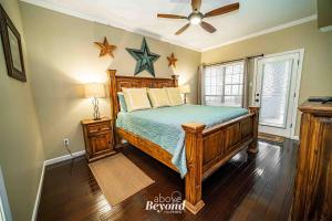 a bedroom with a bed and a ceiling fan at Sunset & Lake View on Island Retreat in Lago Vista