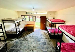 Postel nebo postele na pokoji v ubytování Sunakhari Hostel