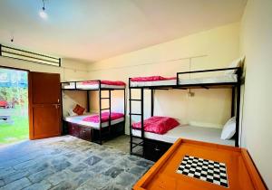 Postel nebo postele na pokoji v ubytování Sunakhari Hostel