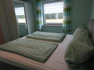 Postel nebo postele na pokoji v ubytování Ferienwohnung Sarah & Thorsten Blum