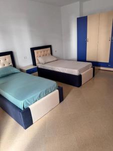 Postel nebo postele na pokoji v ubytování Arena Apartment Elbasan + 2 fotografie