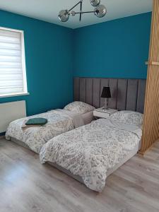 Posteľ alebo postele v izbe v ubytovaní Apartament z łożem małżeńskim - bezpłatny parking