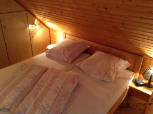 Postel nebo postele na pokoji v ubytování Haus Sandboll DHH2