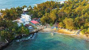 an aerial view of a beach with a resort at Triton Dondra in Dondra West