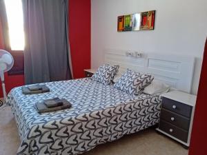 Postel nebo postele na pokoji v ubytování Villas Reina