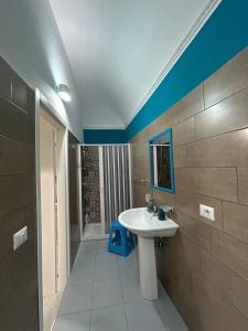 a bathroom with a sink and a mirror at Sofi House in Santo Stefano di Camastra +16 photos