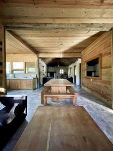 a large room with a table and a couch at Torre de Carpio, Cabaña Molitor in San Isidro