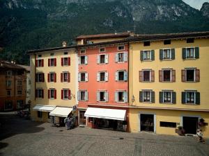 a group of buildings in front of a mountain at Casa Morellato in Riva del Garda