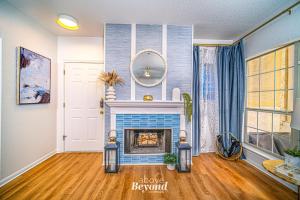 a living room with a blue tile fireplace at Elegant Condo Memorable Spring Lakeview on a beautiful Island in Lago Vista
