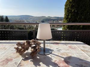 a lamp sitting on top of a table at Schöne Ferienwohnung in Schauenstein-Hof im Frankenwald mit Loggia 100qm in Schauenstein