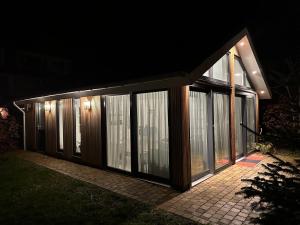 a house at night with a lot of windows at Loft Rêve Beek in Beek