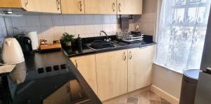 a kitchen with a sink and a stove top oven at 131 on Atholl in Pitlochry