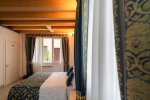 FloVe' Rooms Venice客房内的一张或多张床位