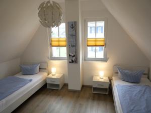 Postel nebo postele na pokoji v ubytování Strandnah Haus "Hertha"mit Infrarotsauna