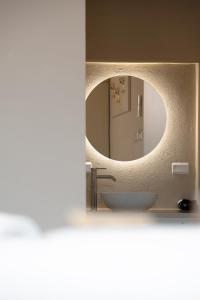 a bathroom with a sink and a mirror at FloVe' Rooms Venice in Venice +37 photos
