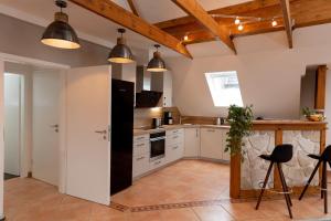 Kuchyň nebo kuchyňský kout v ubytování Ferienwohnung Aurora + 16 fotografií