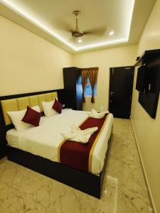 Postel nebo postele na pokoji v ubytování Hotel Sri Kanthan Residency + 13 fotografií