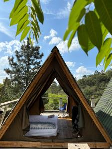 a tent with a mattress inside of it at Eco-Refúgio Cantareira in Mairiporã