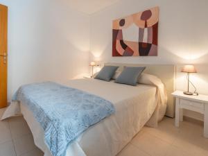 En eller flere senge i et værelse på Apartment Voltor 1A By Sunvillas Mallorca