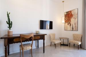 TV a/nebo společenská místnost v ubytování Abalto Suites & Rooms