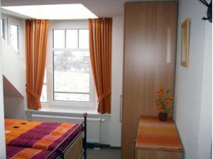 Postel nebo postele na pokoji v ubytování Meerblick aus allen Räumen - de Tampen + 12 fotografií