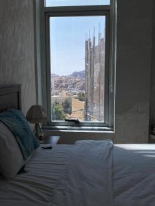 Postel nebo postele na pokoji v ubytování Raqeem Hotel