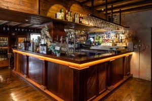 a bar with a wooden counter top in a room at Apartamentos Mariano in Ibiza Town