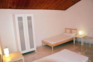 Ένα ή περισσότερα κρεβάτια σε δωμάτιο στο Al vicolo