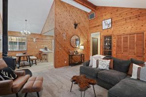 a living room with a couch and a table at Basecamp in La Pine