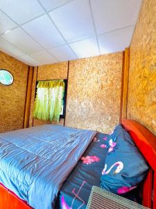 a bedroom with a bed in a small room at Rakkhao inthanon River sunset view in Chom Thong +12 photos