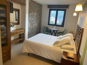 Les Flors - Hotel Rural & Cabanyes客房内的一张或多张床位