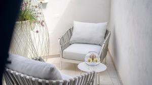 a room with a chair and a pillow on a table at New Dimora Valmar in Polignano a Mare