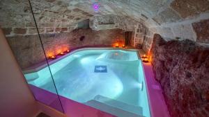 an overhead view of a pool in a stone building at New Dimora Valmar in Polignano a Mare