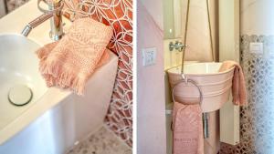 a bathroom with a sink and a towel rack at New Dimora Valmar in Polignano a Mare