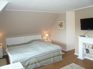 Postel nebo postele na pokoji v ubytování Teewelkenhüs Sonnenappartement
