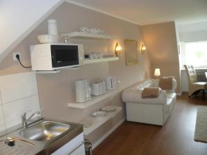 Kuchyň nebo kuchyňský kout v ubytování Teewelkenhüs Sonnenappartement